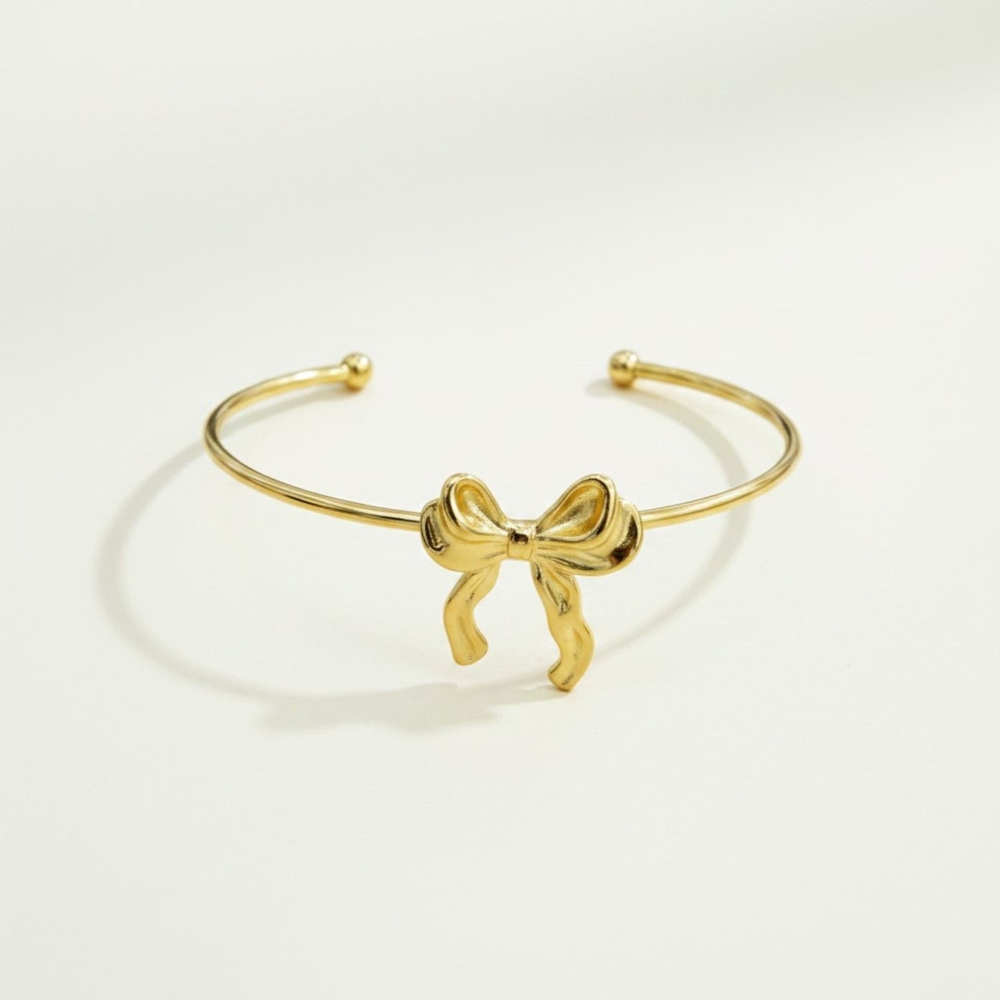 GOLDEN BOW OPEN CUFF BRACELET